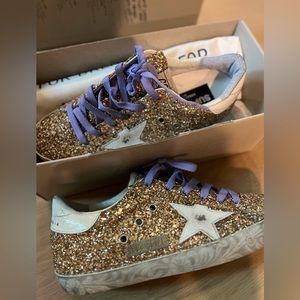Never worn golden goose! SiE 39. Beautiful gold color with lilac laces.